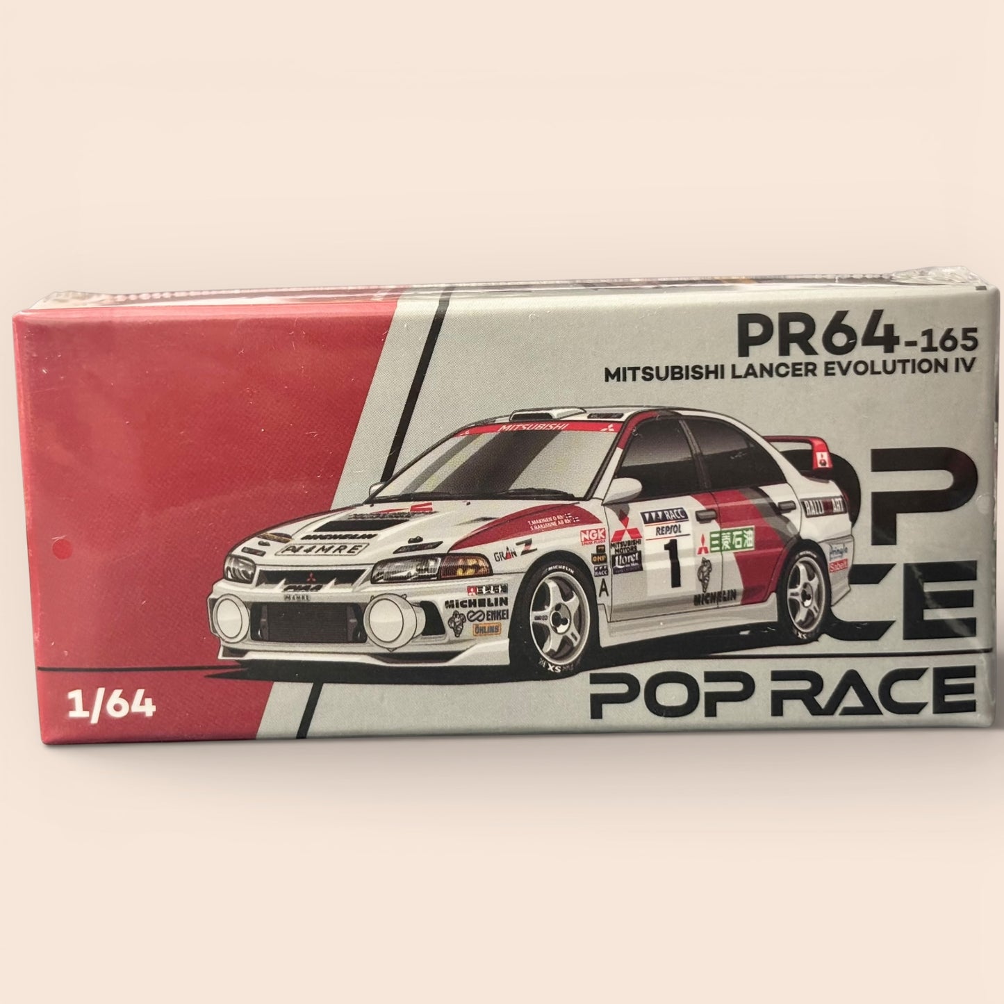 Model car packaging with Mitsubishi Lancer Evolution IV design on a beige background