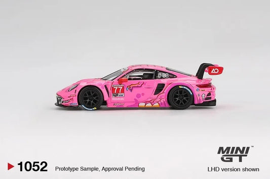 DiecastYard Mini GT Porsche 911 GT3 R #77 AO Racing Roxy pink race car model with detailed IMSA livery side view