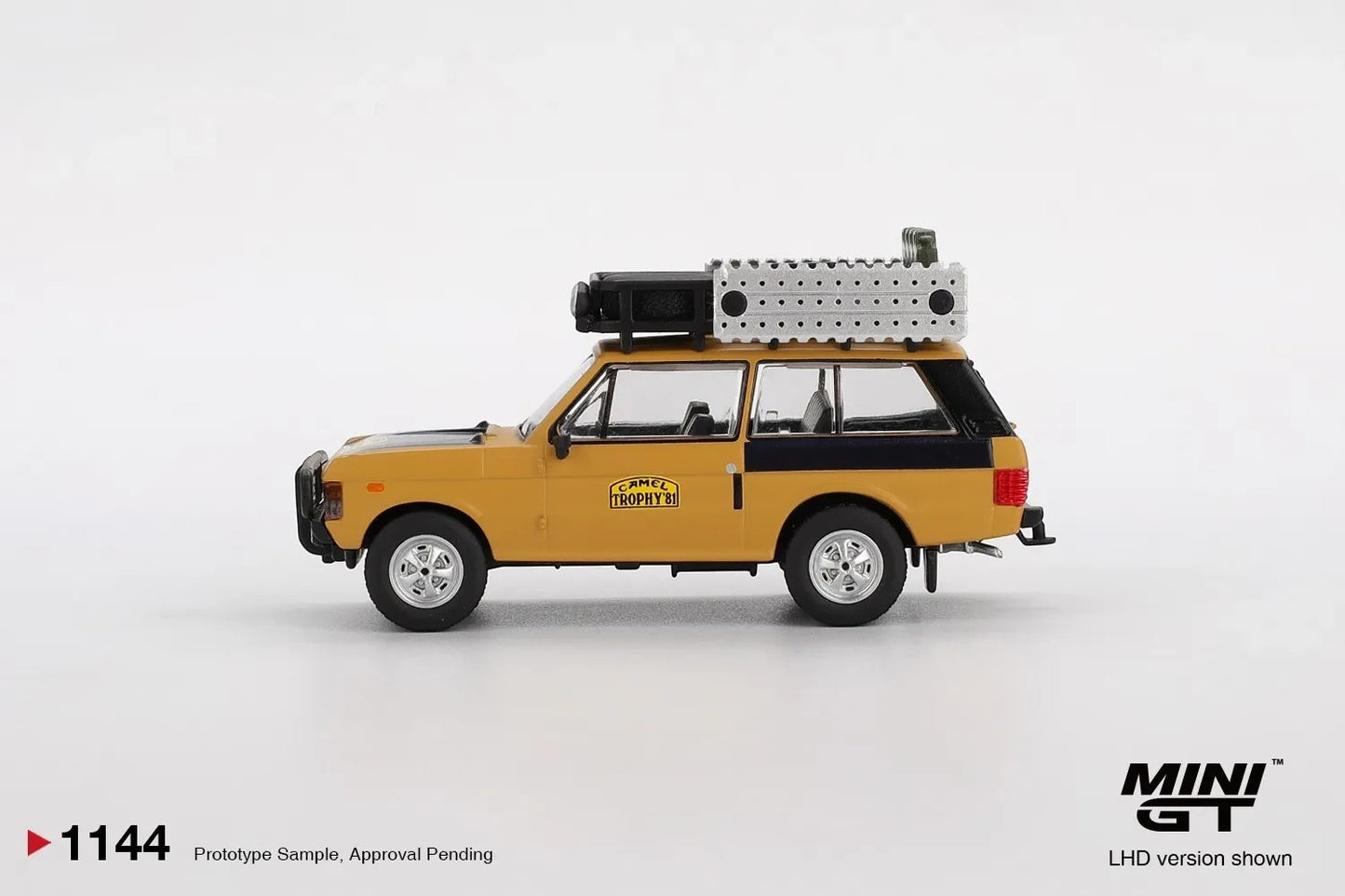 DiecastYard Mini GT 1981 Range Rover Camel Trophy Sumatra diecast model car with roof rack in yellow and black