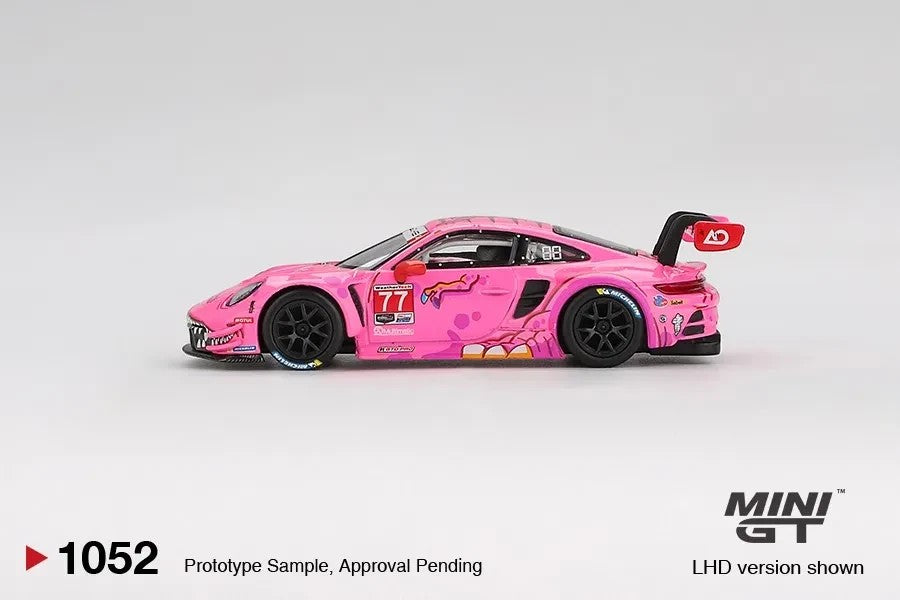 DiecastYard Mini GT Porsche 911 GT3 R #77 AO Racing Roxy pink race car model with detailed IMSA livery side view